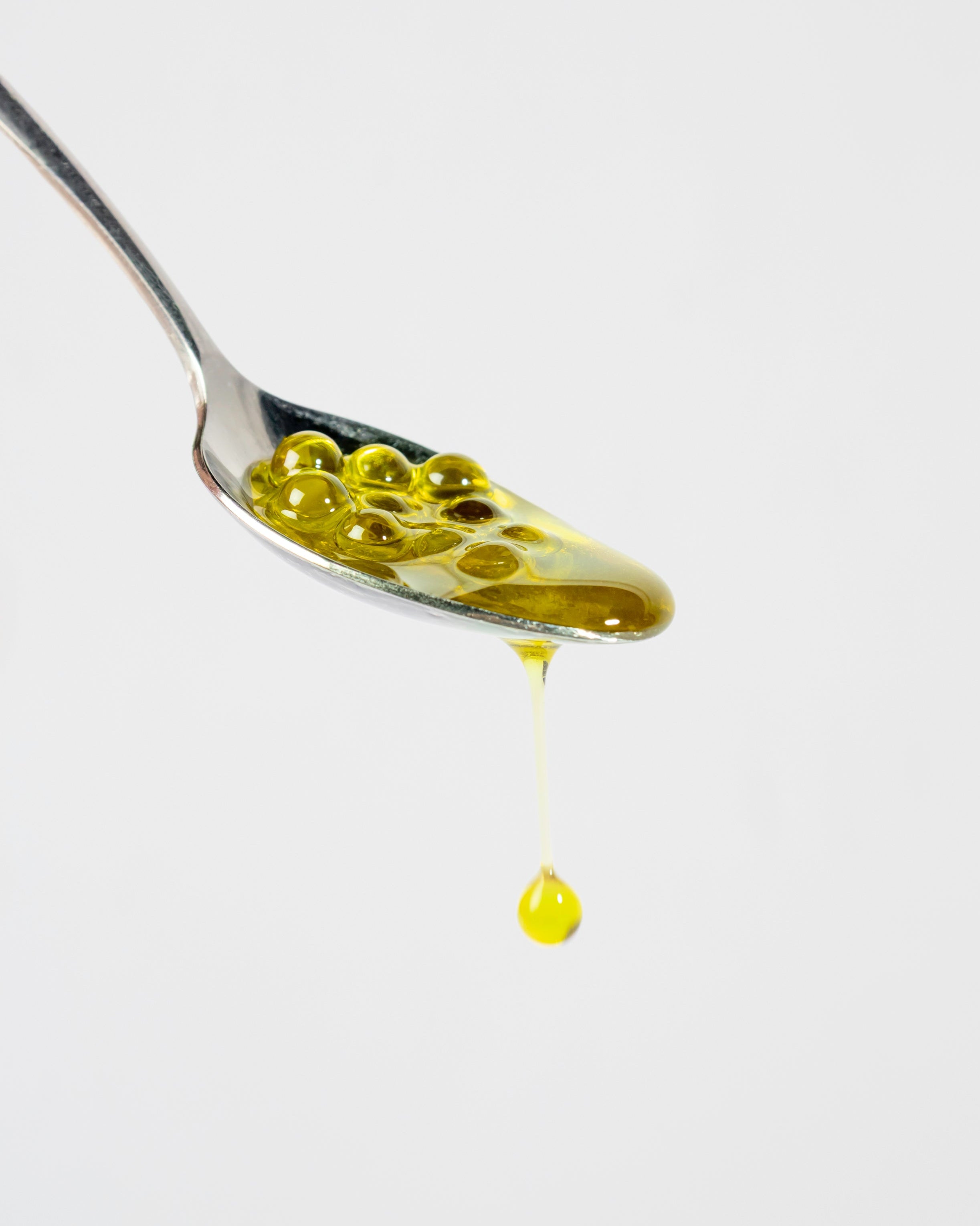 cuillere perles d'huile d'olive